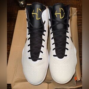 Nike White Black and Gold Athletic Shoes with Gold Accents